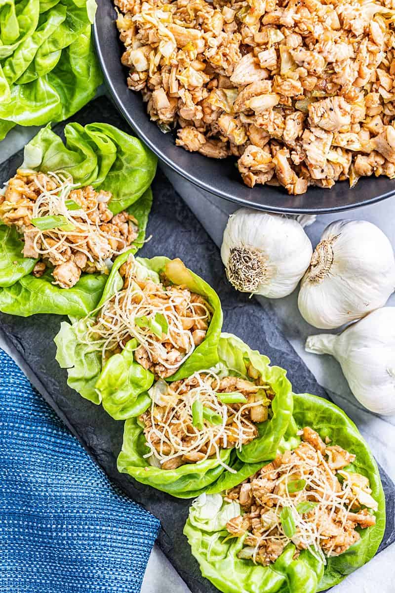 Overhead view of chicken lettuce wraps in a row.