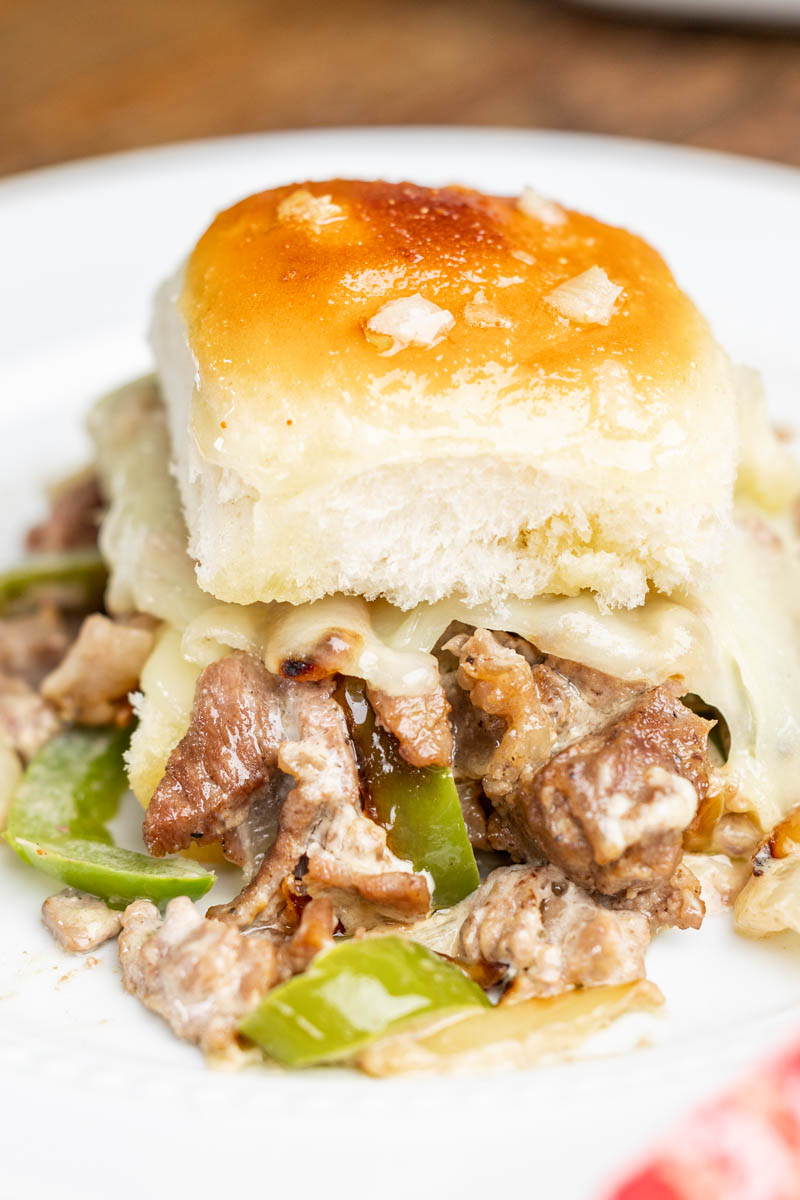 Close up view of a cheesesteak slider.