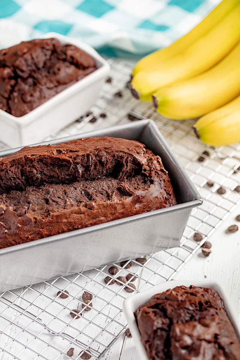 A loaf of chocolate banana bread in a bread pan.