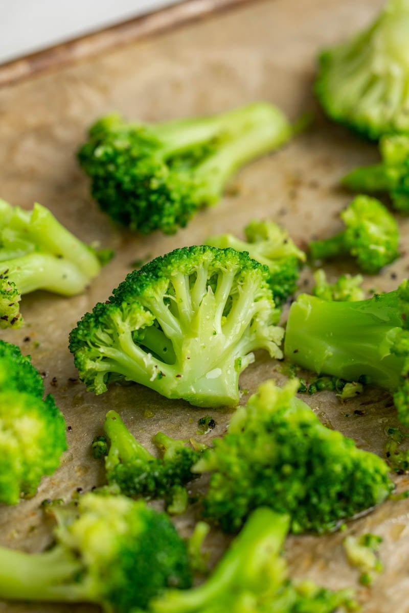 Broccoli cooked from frozen on a baking sheet.