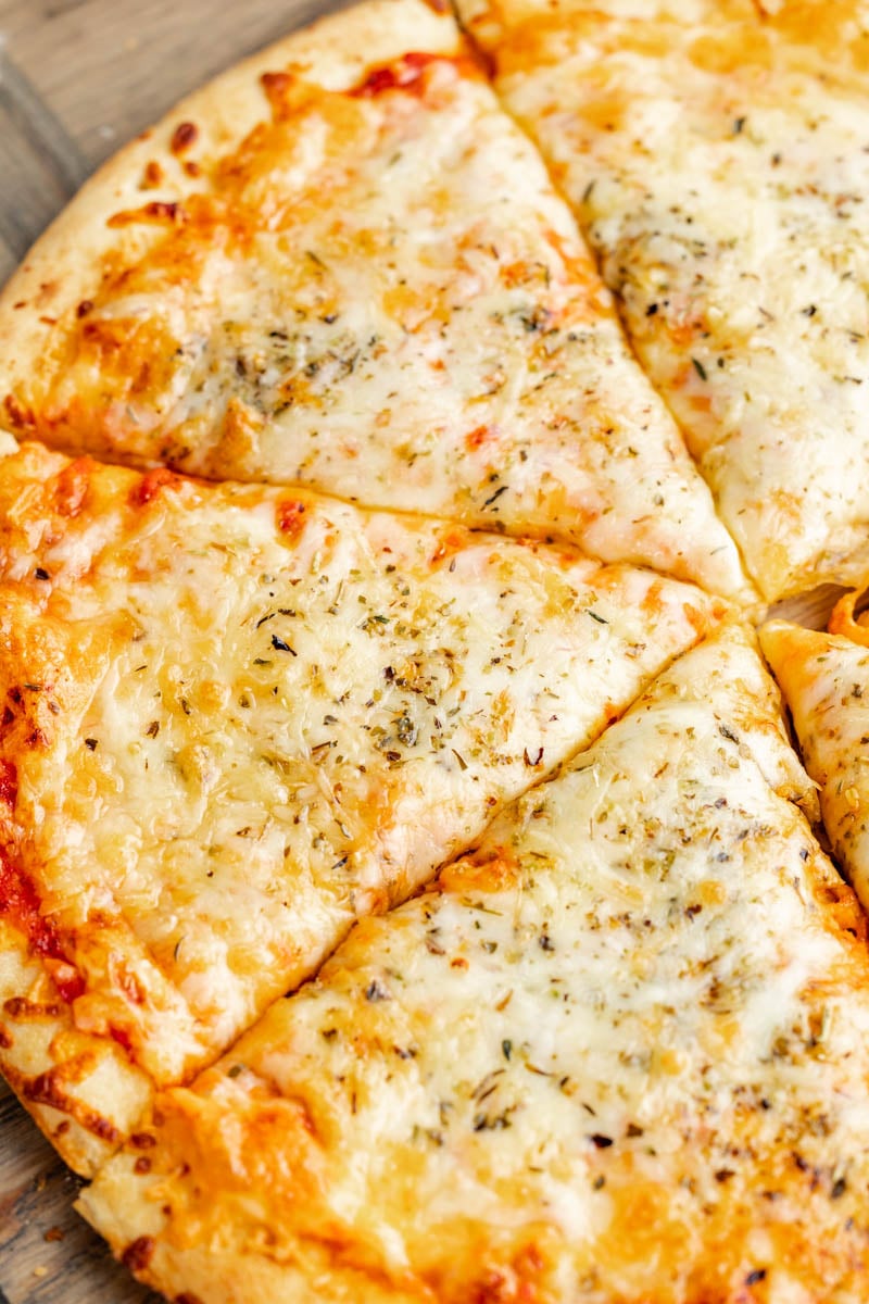 Overhead view of a cheese pizza.