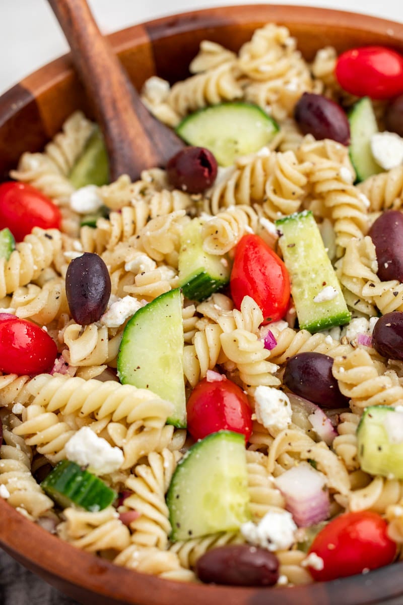 Close up view of greek pasta salad.