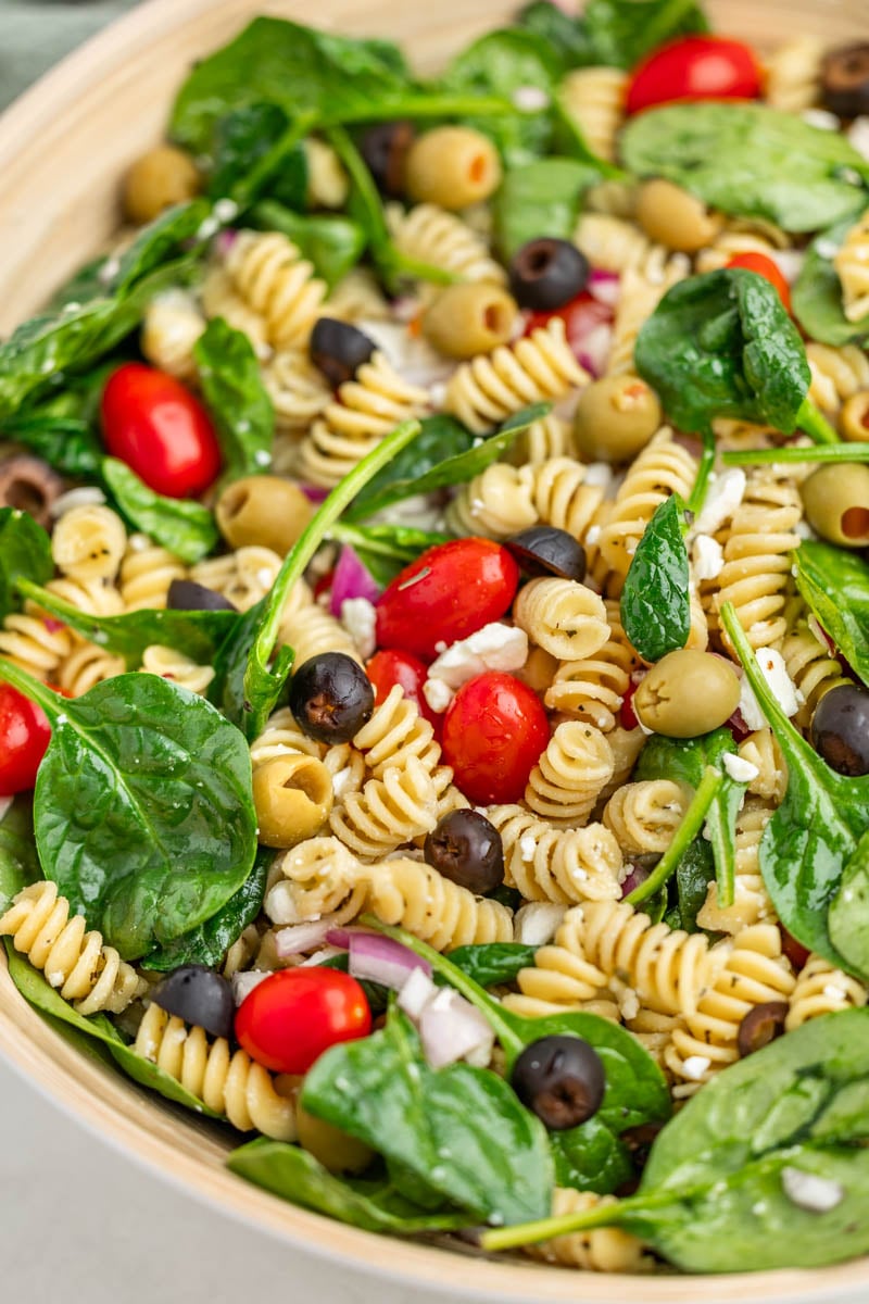 Overhead view of mediterranean pasta salad in a serving bowl.