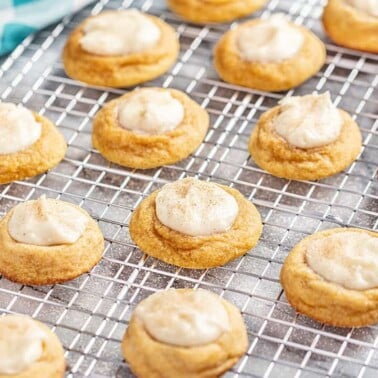 Pumpkin Cheesecake thumbprint cookies on a cooling rack.