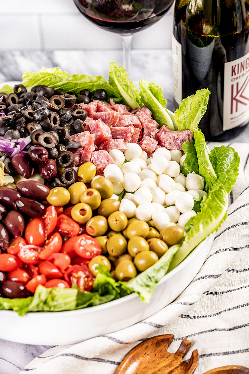 A large serving bowl filled with antipasto salad.