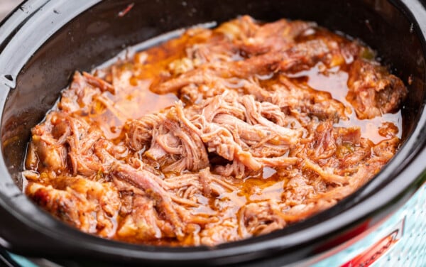 Sweet pulled pork in a slow cooker.
