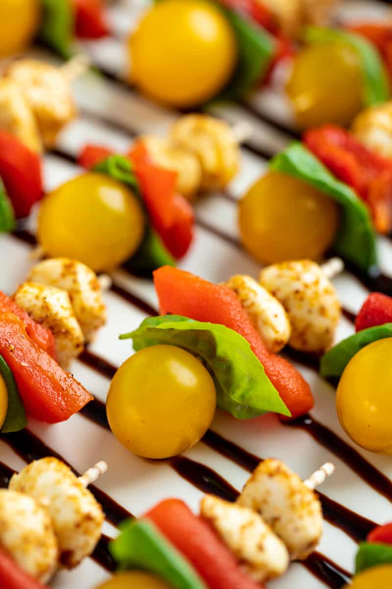 Close up of Southwestern Caprese Bites on a white serving plate.
